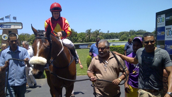 Agape Reigns with her winning owners, a first win for the full sister to Tetelestai. Image: Gold Circle