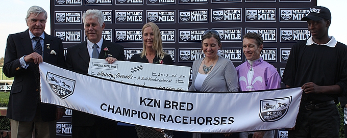 Robin Scott handing over the Robin and Des Scott Trophy to the connections of the Million Mile race, with Koos De Klerk and Nicola Coppez representing the winner owner/breeder. Image: Michael Marnewick