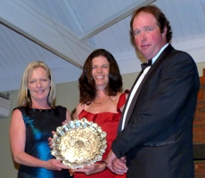 Karin and Warwick Render receiving the KZN Breeders Outstanding Male Sprinter Award for The Mouseketeer from Jennifer Harms, representing the sponsor Equifeeds. Image: Taryn Crawford