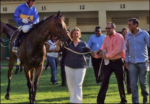 Island Fiesta, being led in by trainer Wendy Whitehead and owners. Image: Gold Circle