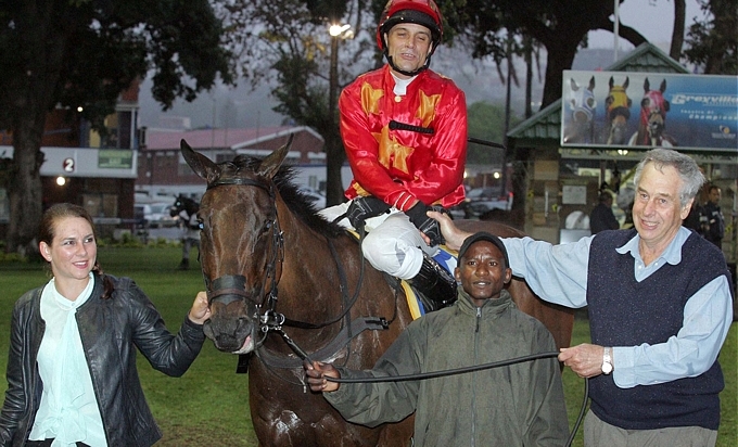Shikra lead in by breeder Robert Smith on the right, it was a double for Robert and sire Al Miqdaam at Greyville on Friday night. Image: Gold Circle