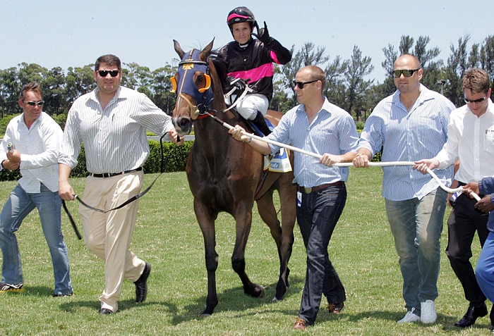 The 3A Racing Syndicate leading in their first winner, Vanilla Twilight, at Clairwood on 18 December 2012. Image: Gold Circle