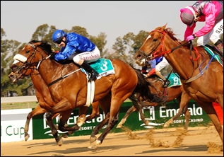 Meadow Magic winning the Emerald Cup with Beacon Flare by Spectrum in the pink silks. Image: tabonline.co.za